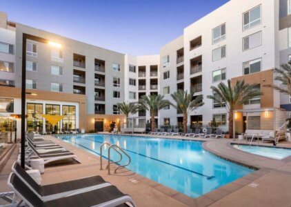 Anaheim CA Apartments for Rent - Rise - Pool Area with Lounge Chairs, Jacuzzi, and Cabana