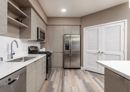 Anaheim Apartments for Rent - Rise - Fully Equipped Kitchen with Stainless Steel Appliances, Granite and Quartz Countertops, and a Designer Kitchen Backsplash